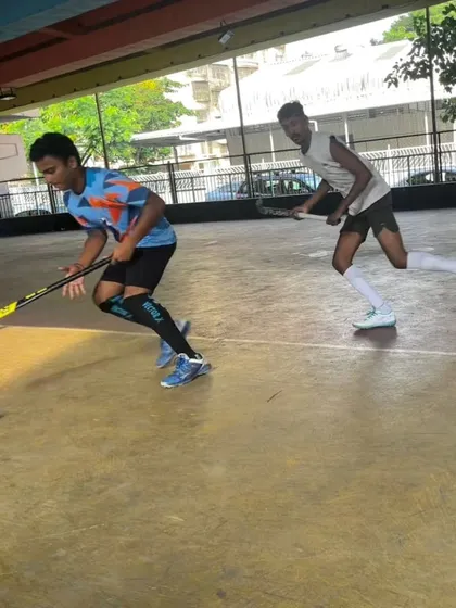 A defender closely marking an attacker. Rink hockey is all about these intense, one-on-one situations that test a player's defensive and offensive skills.
