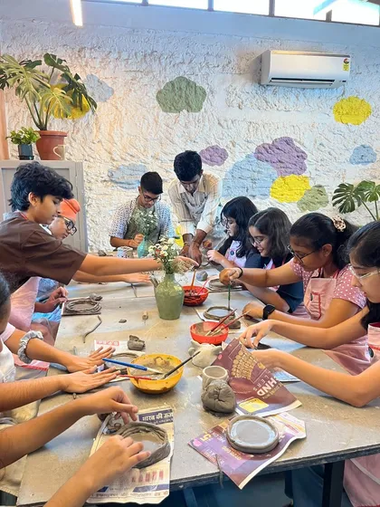 We believe in making art accessible and fun for all ages. This is a snapshot from one of our kids' workshops, where young artists are completely absorbed in hand-building their own clay creations, learning and playing at the same time.