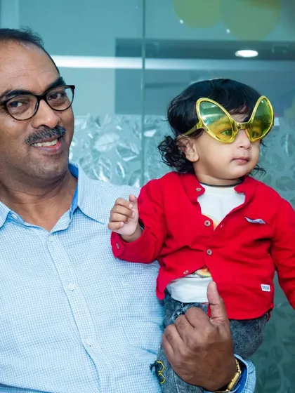 Even the youngest guests can join the fun. This toddler looks adorable wearing a pair of butterfly shaped glasses.