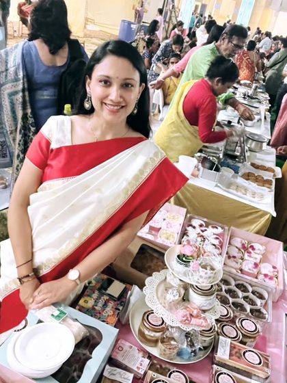 My table full of goodies at a Durgostav event. I had everything from cake jars and cupcakes to my special fusion mithai cakes.