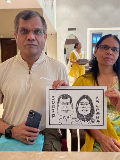 A caricature of a couple, Sudip and Kalpana, from a branding celebration event.