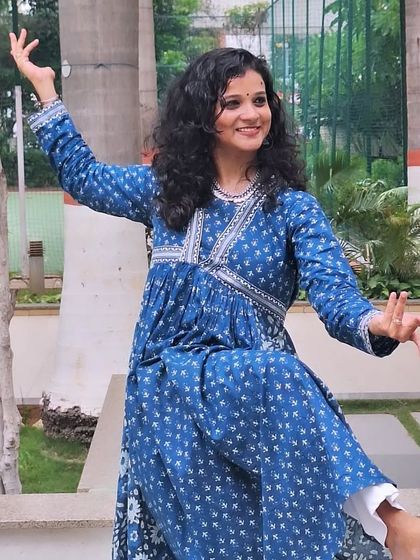 A smiling, expressive close-up capturing the joy of dance.