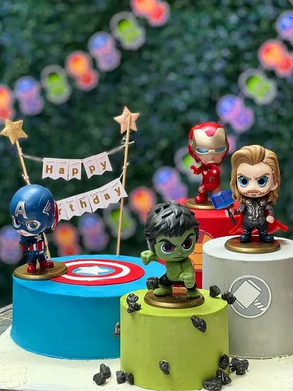 For the little superhero in your life, this Avengers-themed cake setup is always a hit. I created three separate eggless cakes, each representing a different hero, and topped them with high-quality figurines to bring the action to the party. This multi-cake display makes a big impact at kids' birthday parties.