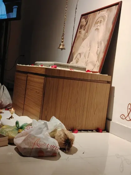 Offerings of sweets and fruits placed before the Sadhguru Sannidhi during Guru Purnima. Every offering is made with gratitude for the path and the presence of the Guru.