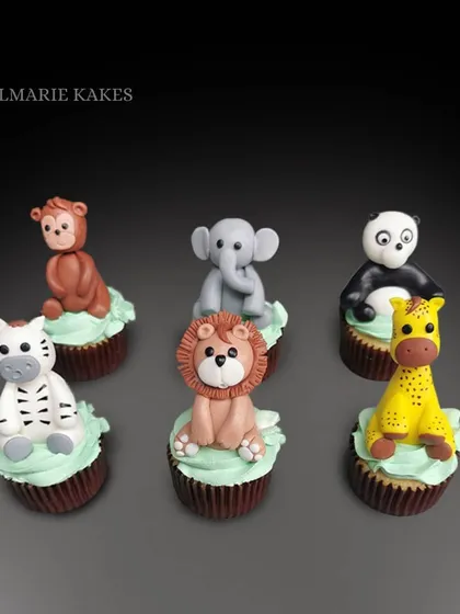 How cute are these little guys? I sculpted these 3D animal toppers from fondant for a child's jungle themed birthday party. From the little elephant to the cheeky monkey, each one was made with so much love.