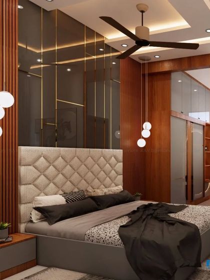 A luxurious bedroom with a dark, moody theme, featuring a tufted headboard, vertical wood slats, and a wall of mirrors.