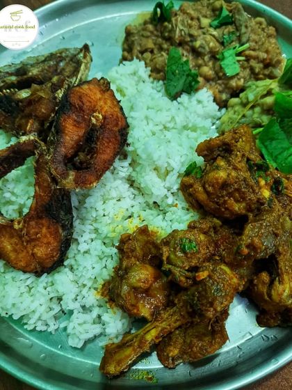 A perfect meal for a rainy day: chicken stir fry, eromba, fried fish, and warm steamed rice.