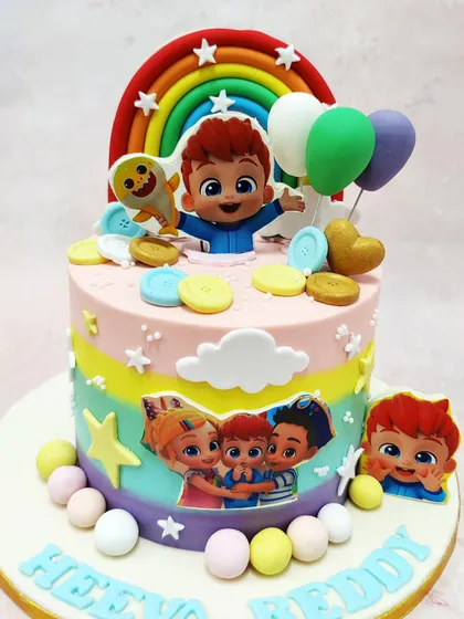 This Cocomelon Rainbow Cake captures the cheerful spirit of the show with multiple characters, a bright rainbow, and pastel-colored decorations.