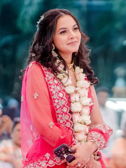 A candid shot of the bride during the festivities, looking radiant and happy.