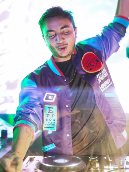 In my element, feeling the music and the crowd's energy. This is the focus and passion I bring to the console at every single event, ensuring a seamless flow of beats that keeps everyone dancing.