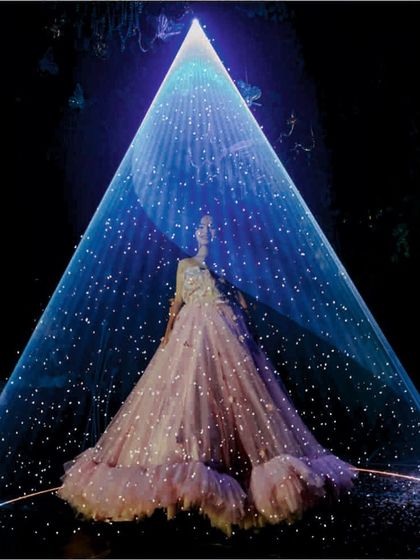 This is a combination of two effects: a laser light spotlight and a snow machine. The result is a magical, winter-wonderland moment, perfect for a unique wedding entry or a themed party performance.