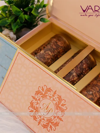 A closer look at a three-jar gourmet hamper, perfect for gifting. The simple yet elegant pink box features a subtle monogram, letting the quality of the contents speak for itself.