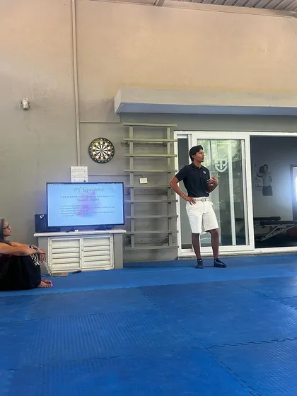 We take wellness very seriously. Here, an athlete presents his experiences and learnings during a monthly session with our wellness mentor, fostering a culture of open communication.