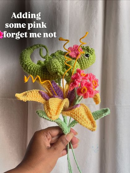 Adding some pink forget-me-nots to the Rapunzel bouquet for an extra pop of color.