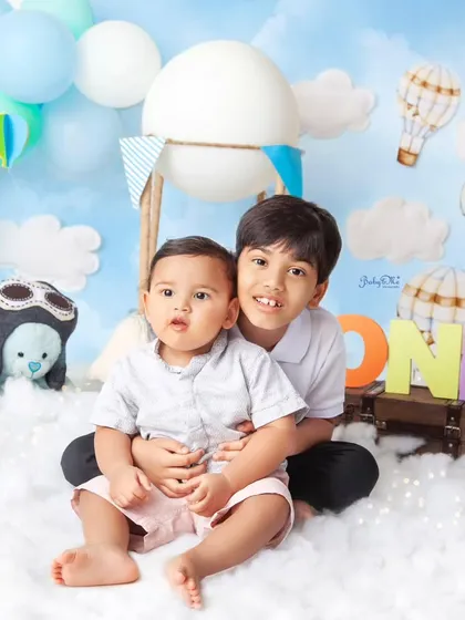 A precious moment between brothers. I always encourage siblings to join in for a few shots. It adds so much love to the first birthday photoshoot.