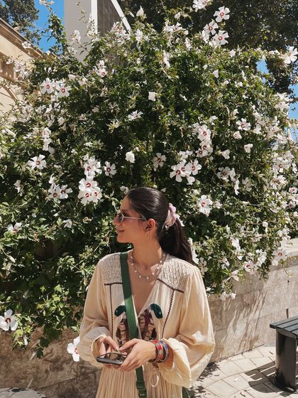 A moment amongst the flowers in Baku. Even when traveling, I love finding spots where my outfit and the scenery just click.