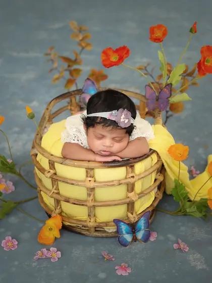 This little butterfly is sleeping in a garden of dreams. I love creating whimsical setups with flowers and props to tell a story.