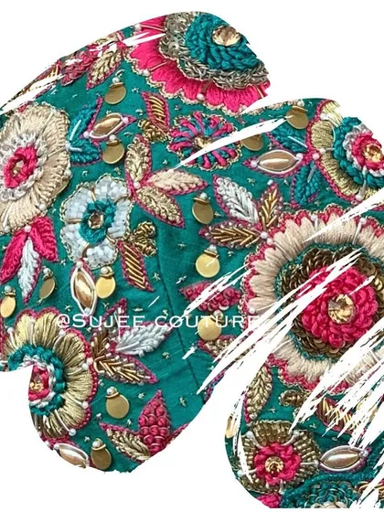 An artistic close-up of the 3D floral embroidery. This shot highlights the layers of petals and the mix of materials used to create each flower.