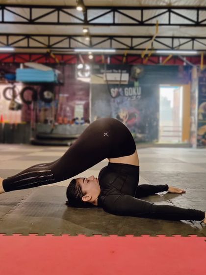 The plow pose (Halasana) provides a deep stretch for the back and shoulders. It's a key part of our mobility work to counteract the effects of intense training.