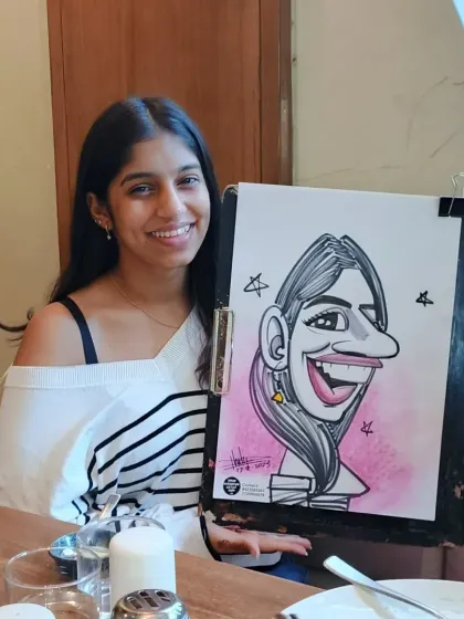 This is the same guest as image 7, showing another angle of her and her fun caricature.