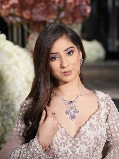 A confident portrait. The makeup is elegant and sophisticated, perfect for a modern bride.