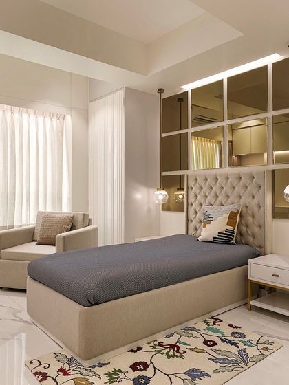 The grandmother's room, though compact, is designed for maximum utility with a single bed and mirrored paneling to visually expand the space.