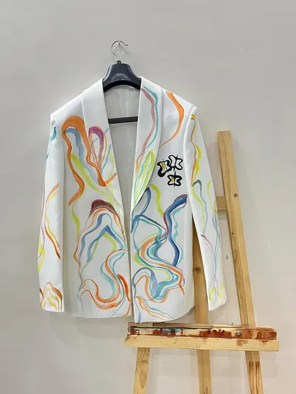 This blazer features abstract lines in vibrant, flowing colors. It's a playful and artistic piece, perfect for someone who wants to make a unique style statement.