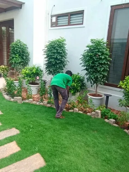 Here you can see us doing what we do best: regular garden maintenance. We're carefully tending to the plants and lawn to make sure everything stays neat, tidy, and healthy all year round.