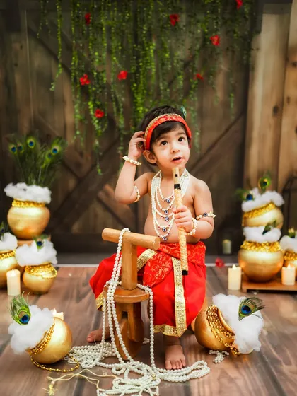 Standing tall with his flute. This little one is ready to charm everyone, just like the real Kanha.