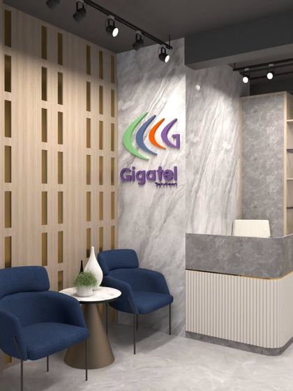 The reception area for Gigatel, featuring a marble-patterned wall, wood slat details, and a modern desk, creating a professional and stylish first impression.