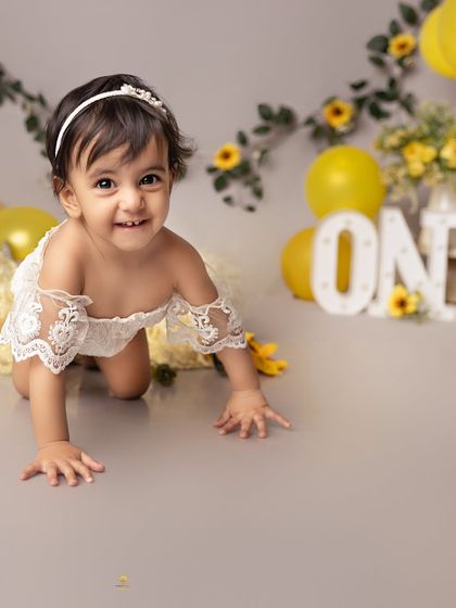 Crawling towards her first birthday cake with the biggest grin. This sunflower-themed session was perfect for capturing her happy and energetic personality at this milestone age.