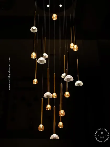 This view from below emphasizes the cascading arrangement of the multi-pendant chandelier, a design that adds depth and visual interest to any space.