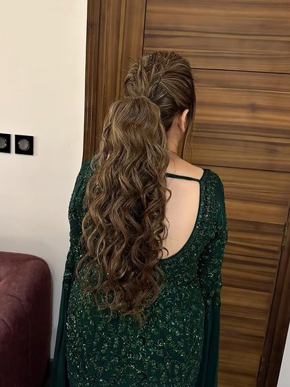 Love is in the texture. This messy, textured ponytail is one of my favorite styles to create for bridesmaids or for a cocktail event. It's effortlessly chic.