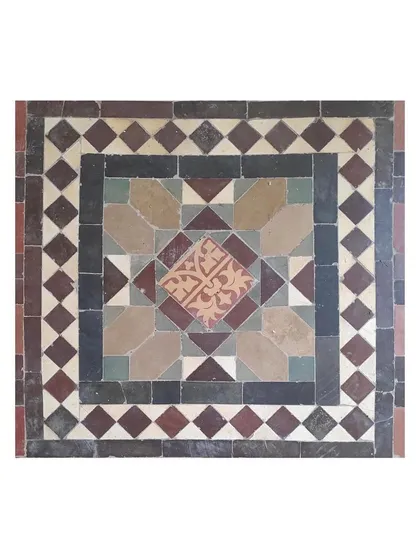 A square tile motif featuring a complex interplay of colors and shapes. Preserving such details is fundamental to our approach to heritage restoration, as they tell the story of the building's aesthetic origins.