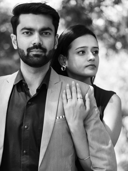 A powerful black and white portrait with a modern, fashion-inspired feel. The clean lines and their confident poses create a very chic urban look.