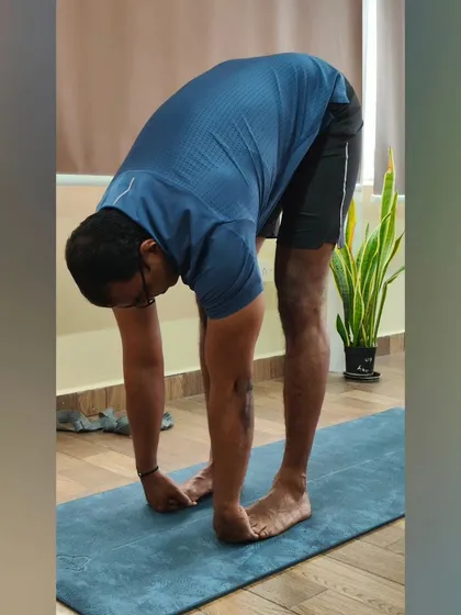 This before-and-after shows a student's journey from stiffness to flexibility in a forward bend. It's a reminder that with consistent practice, you can overcome your body's limitations.
