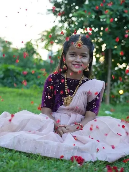 Living in a fairytale moment. This shot captures the magic of a custom outfit, with a rich purple velvet blouse and a dreamy light pink lehenga. I love creating pieces that make your kids feel as special as they are.
