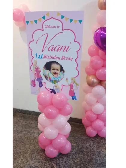 The personalized welcome sign for Vaani's Barbie-themed first birthday party.
