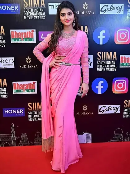 As seen on actress Sreeleela at the SIIMA Awards, this modern pink pre-draped saree offers effortless elegance. The sheer full sleeves and chic belt make it a perfect choice for award nights, receptions, or high-profile parties.