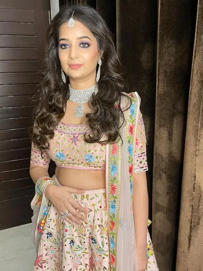 It’s raining glam! This gorgeous client is wearing a stunning pastel lehenga, and I created a purple smokey eye to pick up the colors in the embroidery.