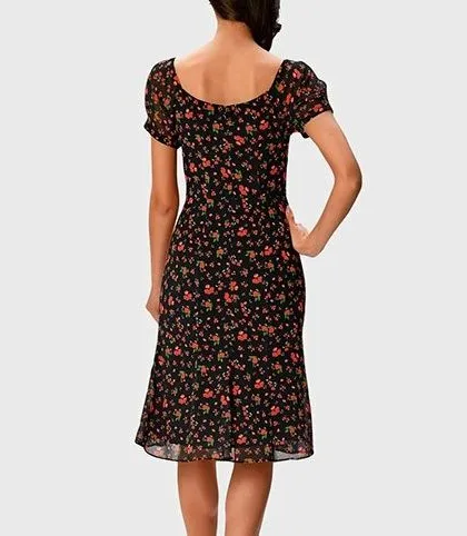 The back of the black floral midi dress features a simple square neckline and a clean, tailored fit that is both comfortable and flattering.