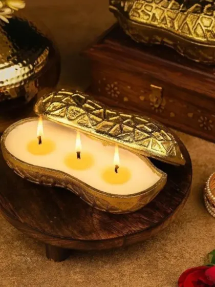 My festive collection includes these unique urli candles shaped like peanuts, almonds, and other dry fruits. Crafted from aluminum with a golden finish, they offer a playful and luxurious twist on traditional decor.