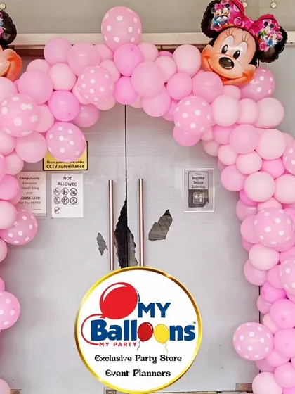 A cute Minnie Mouse-themed balloon arch, perfect for welcoming guests to a pink-filled party.