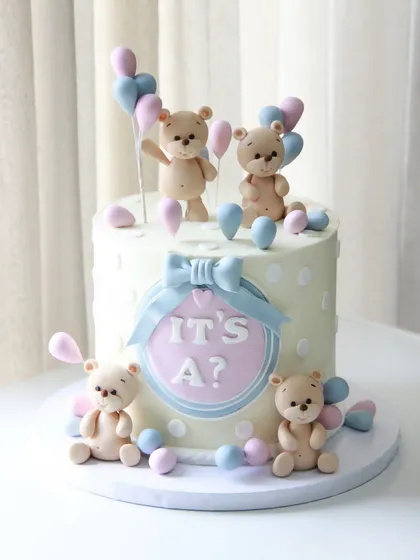 It's a... surprise! This gender reveal cake is full of playful anticipation, with cute teddy bears holding pink and blue balloons.