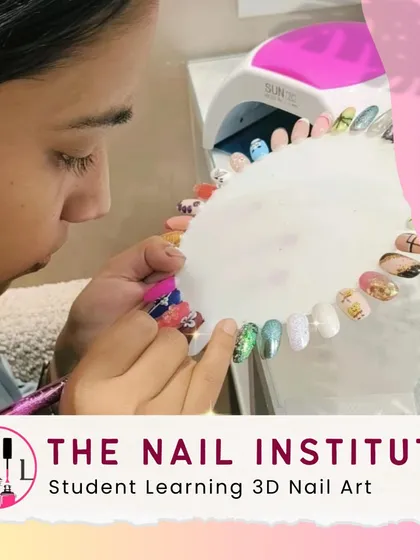 This student is learning 3D nail art, practicing how to create raised designs and apply embellishments for a dramatic effect.
