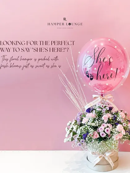 The perfect way to announce "She's here!". This elegant floral hamper, with its beautiful pink blooms and a personalized balloon, is as sweet and lovely as the new baby girl.