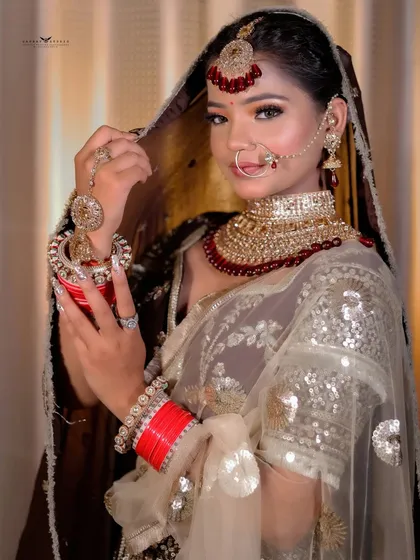 A traditional pose with the bride holding a kalash, perfect for a pre-wedding or festive themed shoot.