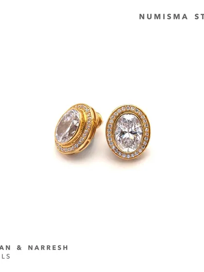 The Numisma Studs by Shivan & Narresh are a chic addition to your everyday statement jewelry collection. They feature a brilliant central stone surrounded by high-grade zirconia.