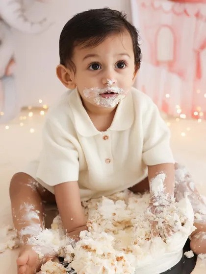 Pure, unfiltered joy. A first birthday cake smash is a celebration of a huge milestone, and I love capturing the messy, wonderful chaos of it all. This image is the essence of that fun, a memory of sweet treats and even sweeter giggles.