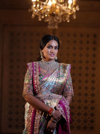 A regal portrait session for a client, featuring a stunning hand-embroidered blouse and a beautiful Kanjeevaram saree. The makeup was designed to give a royal, timeless feel.